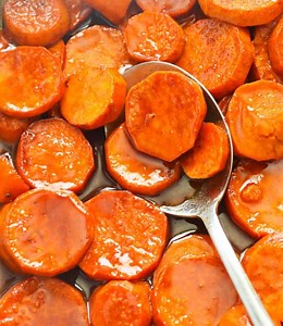 Incredibly fork-tender Candied Yams bathed in a glossy fragrant buttery brown sugar glaze with a zesty hint of lemon and orange. And sensational flavors from warm spices – cinnamon, nutmeg, allspice, and ginger- bring holiday goodness in this amazing side dish. It doubles as a dessert because of its glistening caramel-like finish. Find the full recipe on our blog: www.africanbites.com/candied-sweet-potatoes/ #candiedsweetpotatoes #candiedyams #yams #food #foodie #foodielife #foodlover #foodblog 