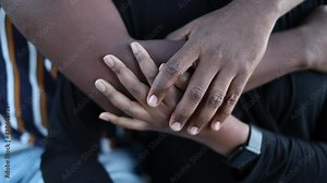 African hands together, couple embrace intimate moment between two people, close-up hand around each other