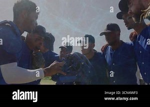 Baseball team huddling, catcher holding mask motivating team, slapping gloves, returning. Sports, teamwork, unity, athletic, competition, outdoor, motivation Stock Video Footage - Alamy