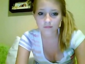 Cute little blonde on her webcam poses and rubs her pussy