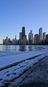 Reflections of the city on a puddle of water at Lakefront Trail Photography & Video Digital | Photography & Video Digital