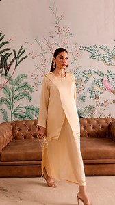1.7K views | This pastel beige silk dress boasts a romantic layered design, with a sweet short overlay buttoned at the shoulder. Price Before Discount: Rs 11,500 After Discount: Rs. 7,450 Visit Now! https://peachrepublic.pk #shopnow #silk #trending #festive | Peach Republic | Facebook