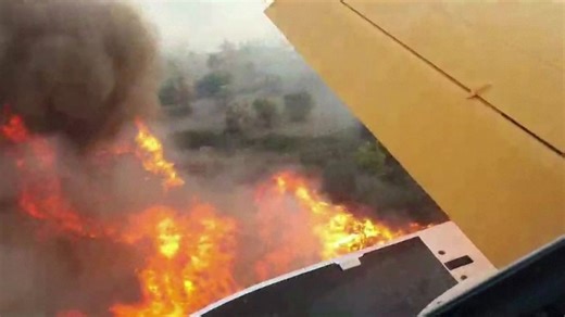 Thousands of holidaymakers flee wildfires on Greek island