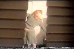 I look into the window and cute blonde stripping