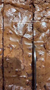 Crinkle top fudgy Brownies 🍫✨ Ingredients 1 cup unsalted butter 1/2 cup dutch processed cocoa powder 1 tsp vanilla 1/2 cup light brown sugar , spooned and leveled 1 3/4 cup powdered sugar 3/4 cup semi sweet chocolate chips 1/3 cup semi sweet chocolate, chopped 3 eggs, room temp 1/2 cup all purpose flour Pinch of salt 3 tbsp olive oil Method: Preheat the oven to 350°F. Grease and line a 8*8 inch pan with parchment paper on all sides and set aside. Place the butter in a saucepan and set over medi