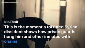 Tortured Syrian dissident shows how guards hung inmates from chains