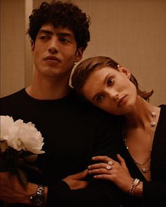 Love to the Moon and back. Giedre Dukauskaite wears the BOUTON DE CAMÉLIA ring in white gold and diamonds, the PREMIÈRE ROCK PINK BLOSSOM watch and the BOUTON DE CAMÉLIA transformable clasp necklace in white gold and diamonds. Cristiano Palmerini wears the highly resistant ceramic and steel J12 watch featuring the Calibre 12.1 Manufacture self-winding movement. #CHANELOverTheMoon #CHANELFineJewelry #CameliaCollection | CHANEL