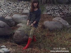 Pink rubber boot in mud again