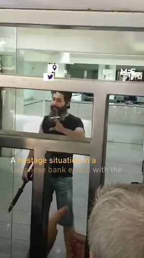 A 42-year-old Lebanese citizen held six people hostage at a bank in Beirut demanding his assets be unfrozen. Dollar deposits have been frozen since the Lebanon's economic collapse in 2019. The gunman surrendered himself when he was promised $35,000 for treatment for his father. | Middle East Eye
