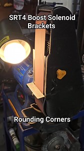 Rounding corners on SRT4 Boost Solenoid Brackets. #beltsander #eastwood #metalfabrication #metalfab #sheetmetalfab #fabricationlife #handmade #stainlessteel #autofab #srt4fab #srt4parts #srt4mods #insaneillusionsfab #insaneillusionsfabrication #lancasterpa #lancastercountypa | Insane Illusions Fabrication & Design