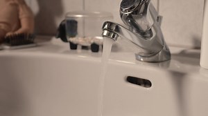 Download a faucet is running water from a sink for free