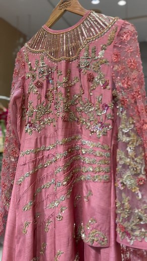 “Exude confidence in this exquisite light pink dress by @shoaibismaildesignstudio. The delicate raw silk fabrication and stunning embroided net tail make a statement, while the fully embellished nude cut neckline with sleek ban adds a touch of allure. #shoaibismaildesignstudio #confidenceiskey #bestdesigner #bestdresses #formaldresses | The House of Shoaib Ismail