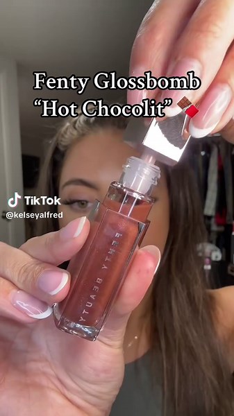💋 lip swatching the Fenty Gloss Bomb in the shade Hot Chocolit over the Fenty Trace’d Out Lip Liner in the shade Extra Thigh 🍫 Hot Chocolit is described as a rich brown gloss with a shiny, hydrating finish ✨ ❗👜💸 find this combo directly linked in my TikTok Shop Showcase! #FentyBeauty #FentyExtraThigh #FentyHotChocolit #LipSwatch @Fenty Beauty #brownlips