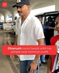 Dhanush was seen at the airport wearing a white shirt paired with blue jeans. He also wore a black cap to complete his overall look perfectly. #Dhanush #MinimalStyle #Fashion | ETimes Lifestyle