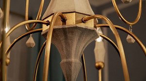 Our Claymore Collection has this regal elegance mixed with natural details. With large sweeping slender metal tubing finished in a rich, hand-applied Gold Leaf, the arms spring from a simple body of solid wood toned in Claystone. Matching wooden charms in the same finish are faceted as they dangle from the chandelier’s arms. Rustic luxury is realized with a pairing of natural elements and refined finishes. http://maximlighting.com/indoor-collection/collection/claymore | Maxim Lighting