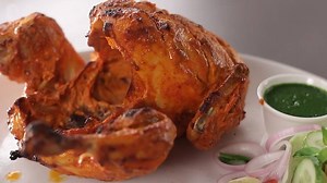 Full Tandoori Chicken- Chunks of chicken on the bone marinated in yogurt with delicious Indian spices - grilled to succulent perfection. Isnt it mouth-watering? | Sanjeev Kapoor