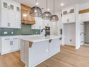 18 reactions | Step into this stylish Bixby Village home with 1,907 sqft of thoughtfully designed living space. From a gorgeous kitchen with quartz countertops to a cozy fireplace in the living area, every detail is crafted for comfort and style. The spacious primary suite offers an elegant retreat with a freestanding tub and a beautifully tiled shower. #BixbyLiving #CraftsmanStyle #OKRealEstate #HomeInBixby #HomeDesign | Ideal Homes | Facebook