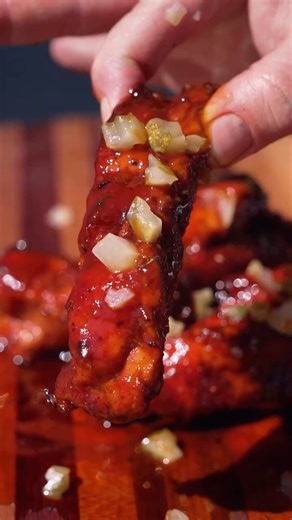 These Pickle Ribs are definitely going to be a crowd favorite! Ingredients 2 racks of baby backs 2 tbsp jalapeno hot sauce 3 tbsp bbq rub 1 half stick of butter 2 tbsp hot honey 1 cup of bbq sauce 1 full jar of pickles and pickle juice Steps 1. Slice up a couple slabs of baby back ribs between the bone and drop them in a brine of straight pickle juice overnight 2. Use jalapeno hot sauce as your binder then hit with your favorite bbq rub 3. Smoke at 250 for about 2 hours or until the color looks 