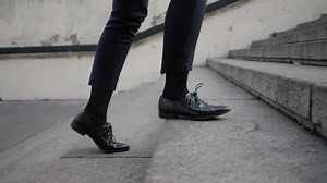 Businesswoman Legs In Black Leather Shoes Walking Up Stairs On Stairway. Sexy Woman Near Office