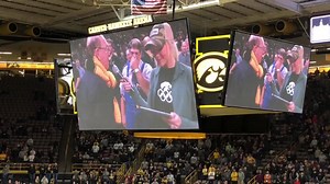 Former Iowa Wrestling coach Dan Gable gets a scarf from Jan Sanderson during Night of Champions at Carver Hawkeye Arena. | National Wrestling Hall of Fame Dan Gable Museum