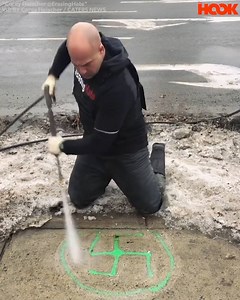 This guy goes around using a powerful jet washer to blast away racist graffiti. He’s erasing hate!! 🙌 | The Hook