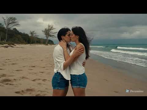 Lesbian kiss between two women on a remote beach Part 3