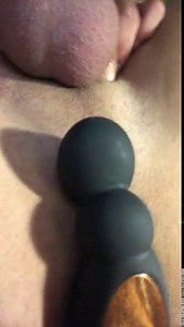 Rotating prostate massager with huge cock in a chastity