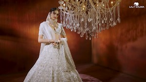 LALIT DALMIA BRIDAL COUTURE 2024 Lalit Dalmia’s “INNAYAT” Bridal Lehenga & “ZOHRA” Couture Sherwani Lalit Dalmia’s “INNAYAT” bridal lehenga from the esteemed Rajvanshi Queens Collection is a mesmerizing embodiment of luxury and elegance. This jeweled pearl-embroidered couture lehenga is 100% handcrafted. Lalit Dalmia’s “ZOHRA” couture sherwani from the esteemed Rajvanshi Kings Collection is a masterpiece embodying the celestial beauty of the stars. This nawabi ensemble in the regal ivory hue, cr