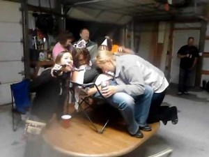 Drunk chicks "posing for pictures" while messing with their passed out friend.