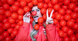 Giant red ball pit appears in UK city for adults to have fun