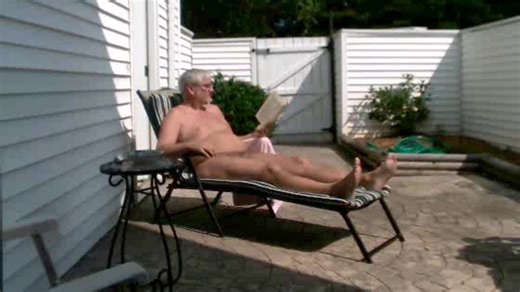 NUDE SUNBATHING, READING, SMOKE