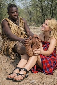 Behind every strong man is a woman who isn't afraid to get her hands dirty to care for him. After miles of trekking through the bush, Luna shows what true love looks like— . . #HadzabeLove #ChabaAndLuna #TrueDevotion #AfricanTradition #BushmenCulture #WildLove | Africa Real Tribe