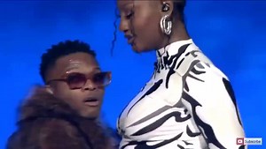 Reactions As Tems Stops Wizkid From Rocking Her While On Stage [Video]