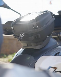 What is the weirdest thing you’ve brought with you on a trip? 🦅 Discover the Tank Bag and all the available accessories for your V85: bit.ly/Accessories_MotoGuzzi. #MotoGuzzi #V85 | Moto Guzzi