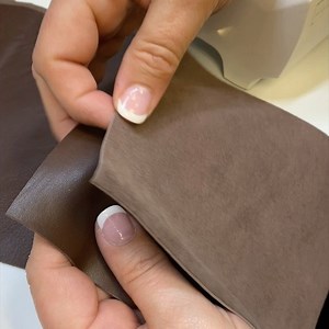 Tips for Sewing Leather: 1) Insert a leather needle which has a wedge tip, making cleaner holes in the fabric. 2) Attach a nonstick foot. 3) increase the stitch length to avoid possible perforation of the leather. 4) Use paper clips or binder clips to hold the fabric together instead of pins, as pins would leave permanent holes in the leather #tipsandtricks #sewingtips #itstartswithastitch #sewingleather #singersewingmachine | Singer Sewing