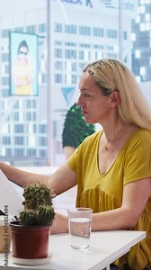 Vertical video Financial adviser assisting clients in setting up investment accounts, transferring assets and executing financial transactions. Agent utilizing financial planning software to help