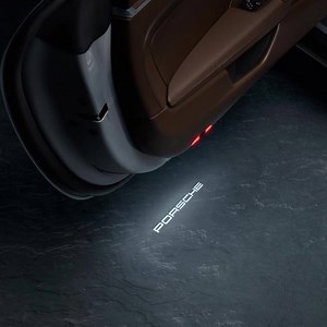 Luminate your passion for Porsche – especially when you make an entrance. Discover the LED door projectors from Porsche Tequipment, and project a clear statement. | Porsche centre Accra