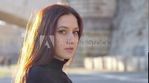 sensual brunette smoking cigarette staring at camera- slow motion-outdoor