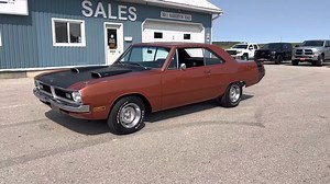Sold Sold Sold! Have a look at this beautiful 1970 Dodge Dart Swinger finished in the original FK5 Dark Burnt Orange Metallic. It is a factory 340 Swinger with a 4-speed standard transmission. The 8 3/4 rear end has 3:55 gears and Sure Grip. The 340 was upgraded with a Demon carb and Edelbrock intake manifold. The Headers and dual exhaust system with Flowmaster mufflers sounds amazing. This ’70 Dart is equipped with manual steering and manual brakes with 4-piston front disc. It still has its ori