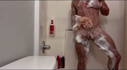 Football hunk showering