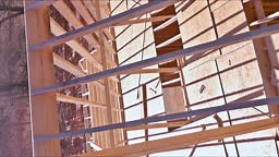 Wooden roofing framework consists of trusses beams were built while...