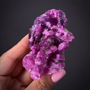 Corundum var. Ruby - Ganesh Himal, Dhading Dist., P3 Bagmati Pradesh, Nepal More info: https://www.irocks.com/minerals/specimen/52367 This is a large and very colorful cluster of rich pink-red ruby crystals from the super-high altitude mines in Ganesh Himal in Nepal. It is extremely sculptural and artistic. It is rare to see large groups of incised ruby crystals and this particular piece shows very attractive complex etching patterns. It has a very complex shape exhibiting intricate detail where