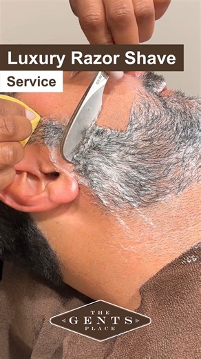 Indulge in Luxury Razor Shave! 🪒✨ Discover why we're one of Esquire Magazine's "Most Luxurious Shaves in America." Our Luxury Razor Shave is not just a service; it's a world-class experience every gentleman should treat themselves to. Unwind, relax, and let our expert barbers pamper you to perfection. Feel the luxury with every stroke. Your skin deserves it. 💈💆‍♂️ #LuxuryRazorShave #WorldClassGrooming #GentlemanExperience #TheGentsPlace #Luxury | The Gents Place