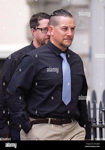 A screen grab taken from PA Video of Metropolitan Police constable Perry Lathwood arriving at Westminster Magistrates' Court, London, where he will appear for sentencing for assault by beating in relation to bruising injuries caused to the woman's arm during the incident on July 21 2023 in Whitehorse Road, Croydon. Pc Lathwood is attached to the Met's Road Traffic Policing Command. Picture date: Friday June 14, 2024 Stock Photo - Alamy