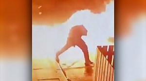 CCTV footage shows a man being engulfed by a fireball during an alleged arson attempt. | USA TODAY Video