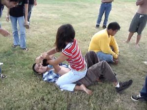 girl beating up guy