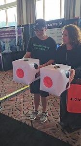 Team toss at the Greater Giving booth at National Auction Foundation. What do you think of their technique? | Greater Giving