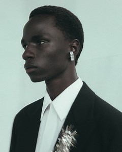 An oversized black single-breasted tailored jacket and wide-legged trousers embellished with silver sequins and crystal astral embroidery. Discover the #McQueenMenSS23 collection: https://on.alexandermcqueen.com/MensSS23_FB Video by Ebba Hult Music Director: John Gosling Track: D-Rail by Filterbeds. | Alexander McQueen