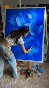 Aquatic Immersion: Large-Scale Abstract Expression In this dynamic acrylic painting by @katesalinger, we witness contemporary abstract expressionism applied to large-format canvas. The artist creates flowing, aquatic forms through bold brushwork and saturated cobalt blues, demonstrating confident handling of paint application and color intensity. The scale allows for physical engagement with the painting process—the artist's full-body involvement visible in the sweeping gestural marks. The monoc