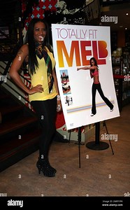 Mel B really is totally fit! Former Spice Girl and "Dancing with the Stars" contestant Mel B shows off her shapely figure in a slim-fitting yellow tank top and black leggins as she attends an interview and DVD signing for her latest fitness video "Totally Fit" at the Virgin Megastore in Hollywood, CA. 2/12/09 Stock Photo - Alamy